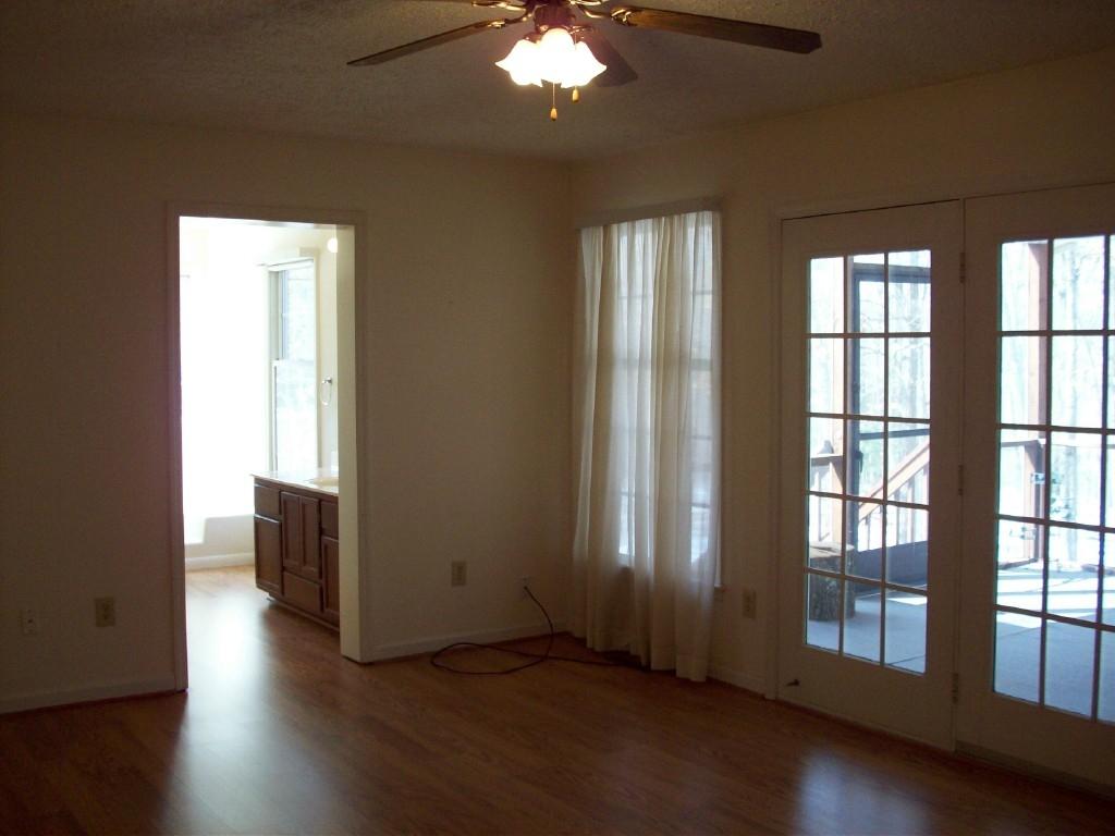 3379 Retreat Road Boones Mill, VA 24065 - Photo 3 of 6 a view of a livingroom with wooden floor and a large window