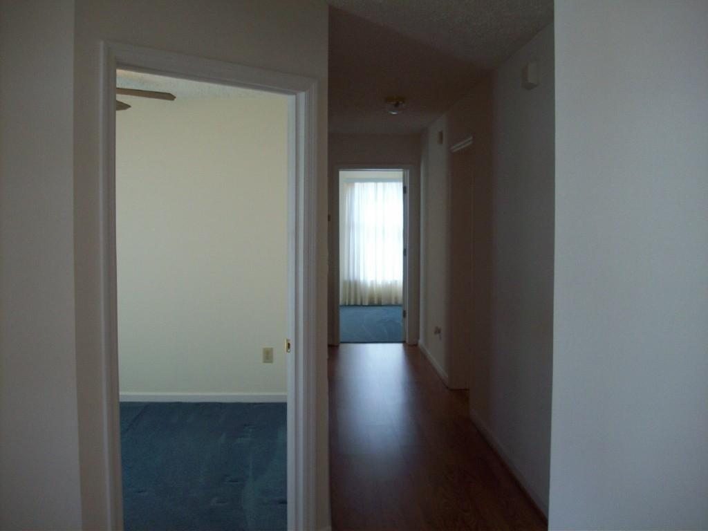 3379 Retreat Road Boones Mill, VA 24065 - Photo 5 of 6 a view of a hallway with wooden floor