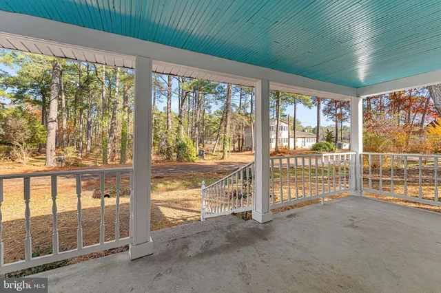a view of an empty room with windows