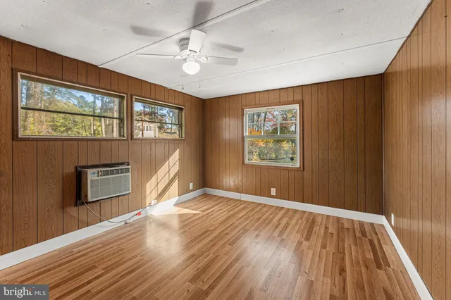 a bathroom with a sink toilet a mirror and shower