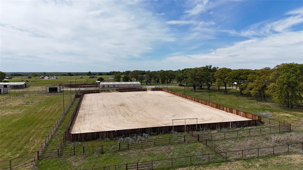 990 Doss Road Millsap, TX 76066 - Photo 6 of 39 a view of a swimming pool with an outdoor seating and trees