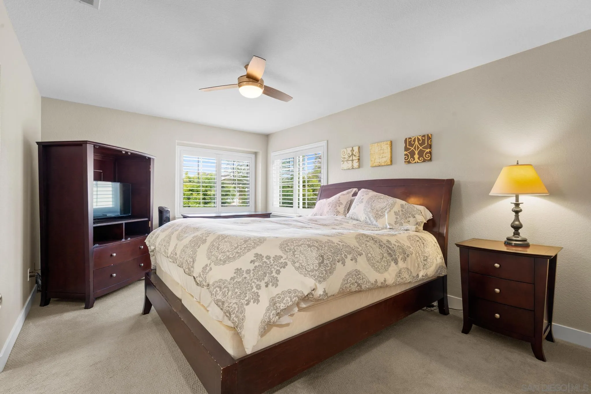 1942 Arbor Glen Escondido, CA 92025 - Photo 14 of 25 a bedroom with a bed and a chandelier