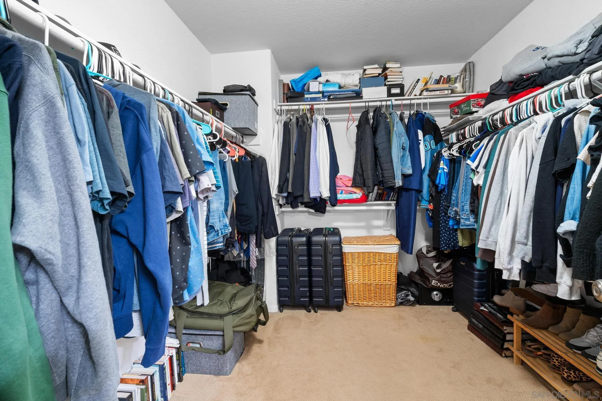 1942 Arbor Glen Escondido, CA 92025 - Photo 15 of 25 a view of walk in closet with clothes