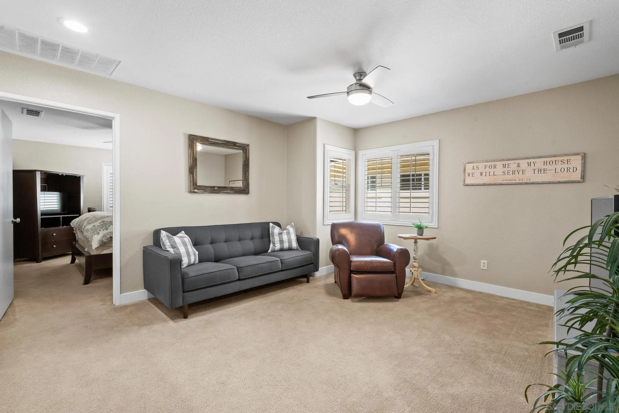 1942 Arbor Glen Escondido, CA 92025 - Photo 18 of 25 a living room with furniture and a window