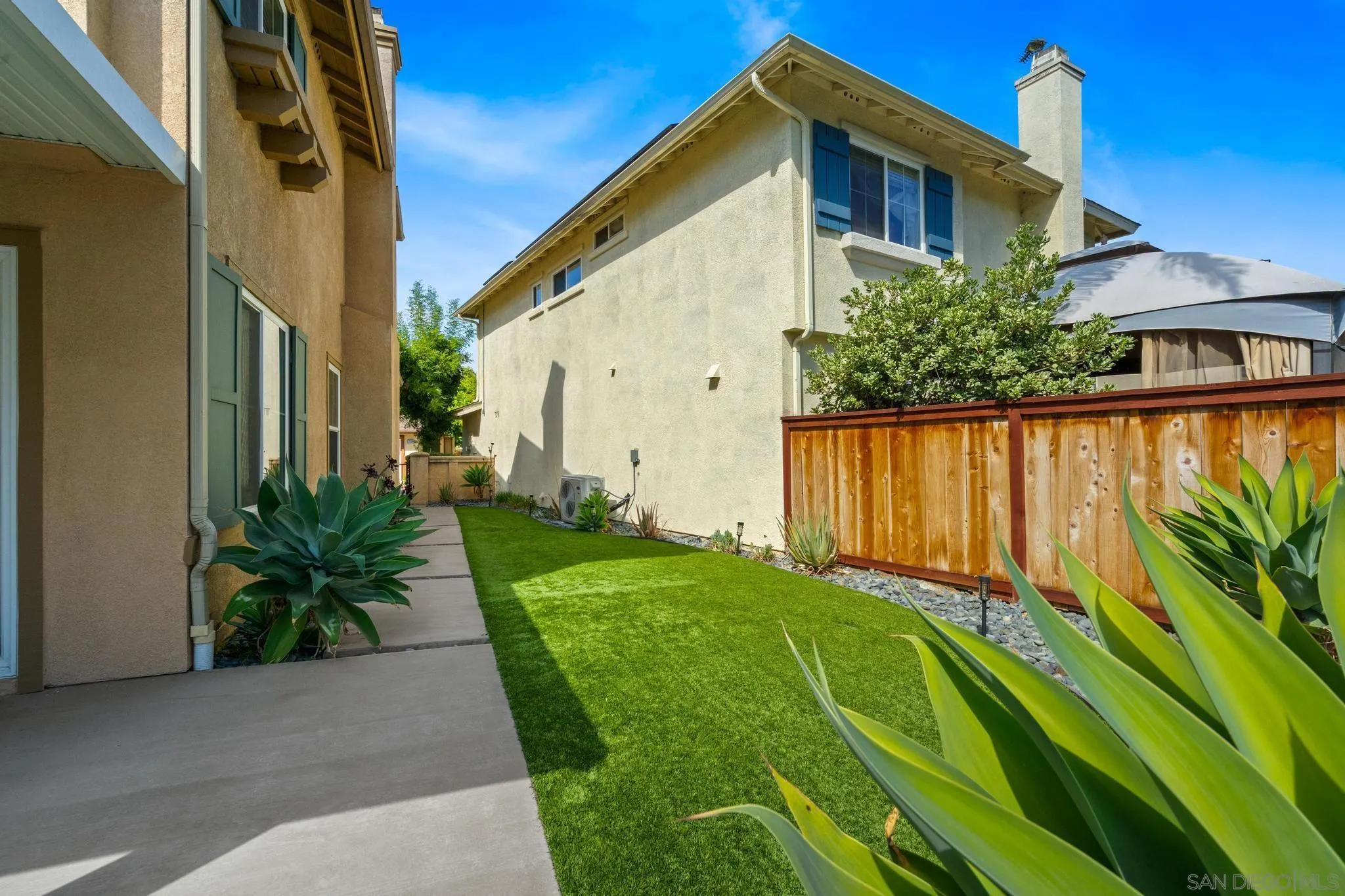 1942 Arbor Glen Escondido, CA 92025 - Photo 24 of 25 a view of a house with a yard