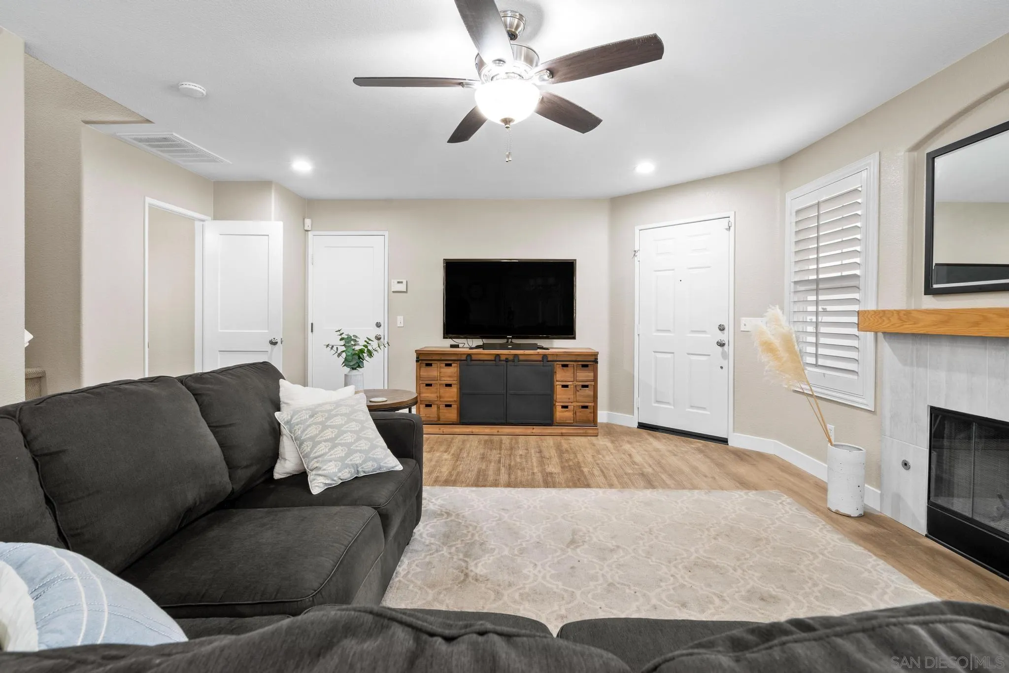 1942 Arbor Glen Escondido, CA 92025 - Photo 6 of 25 a living room with furniture and a flat screen tv
