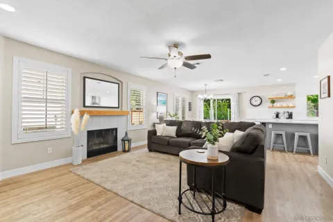 a kitchen with a refrigerator and a stove top oven