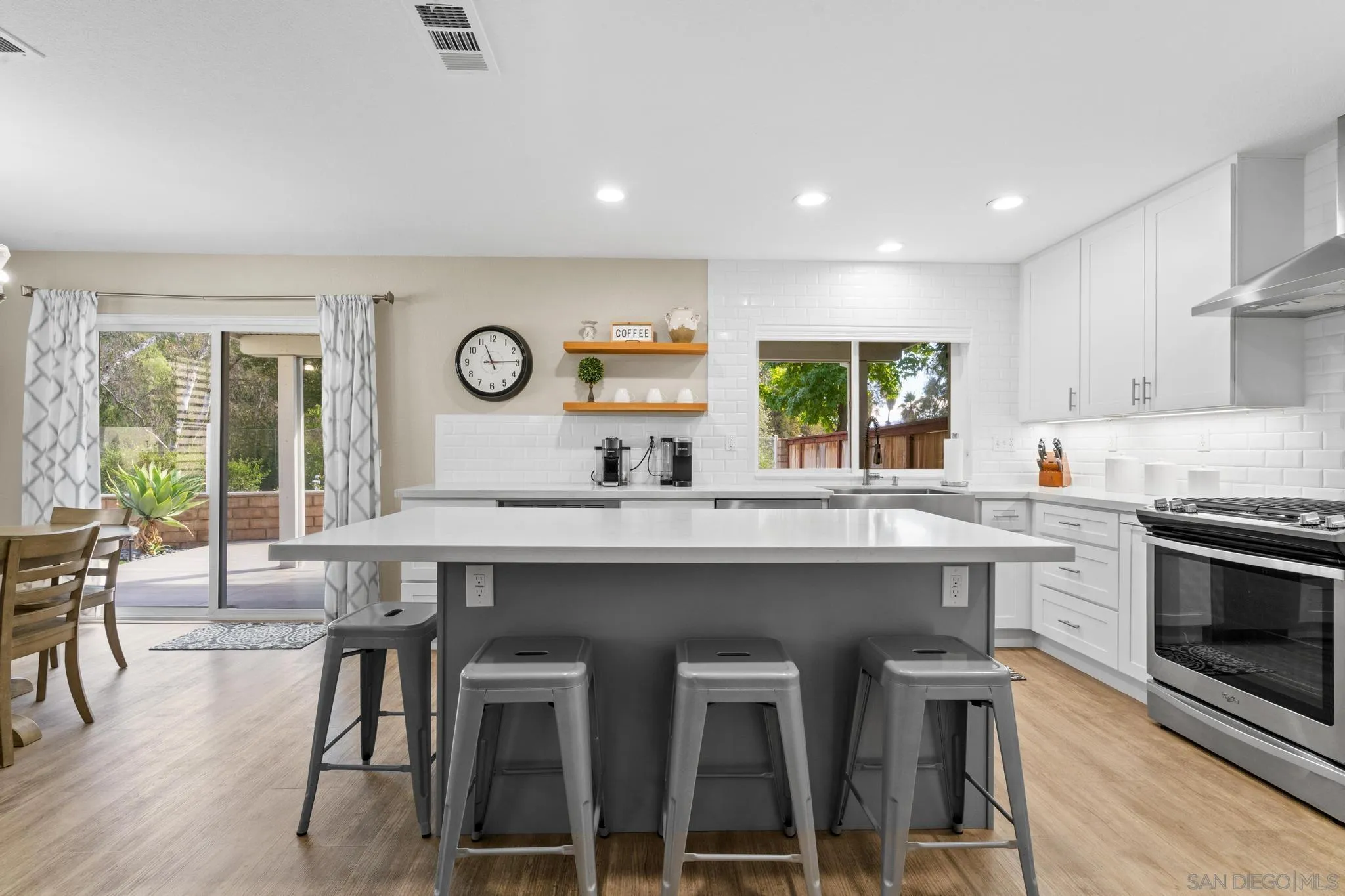 1942 Arbor Glen Escondido, CA 92025 - Photo 9 of 25 a kitchen with a sink and chairs