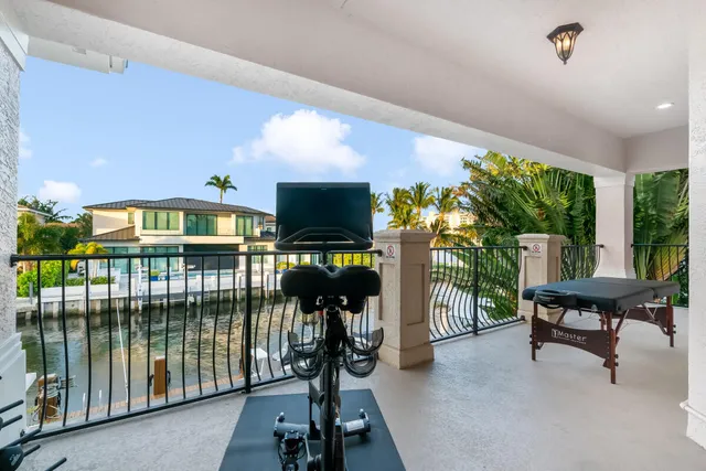 a view of a livingroom with furniture and floor to ceiling window