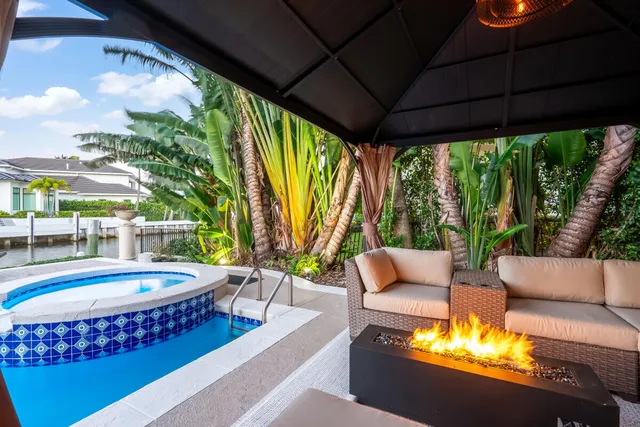 a outdoor space with a table and chairs