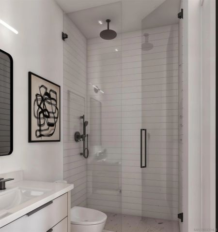 a bathroom with a toilet sink and shower