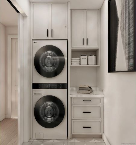 a view of a livingroom with washer and dryer