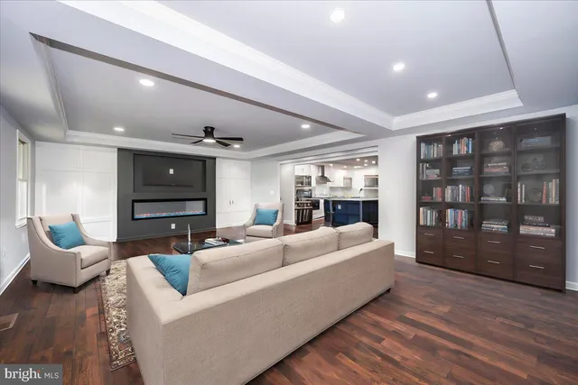 a large kitchen with stainless steel appliances granite countertop a stove a sink and a granite counter tops with white cabinets