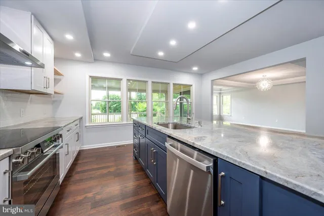 a bathroom with a shower sink and mirror