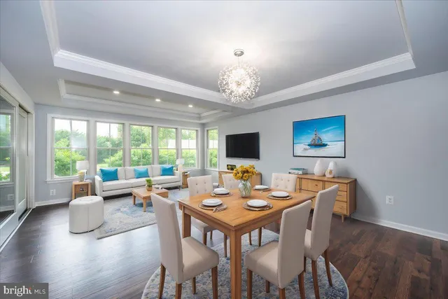 an empty room with a ceiling fan and window