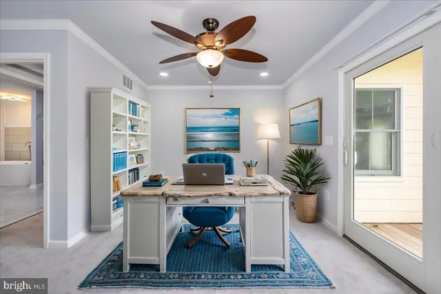 a view of a balcony with wooden floor and a bench