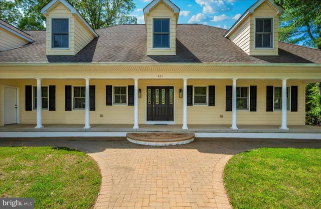 an empty room with window and wooden floor