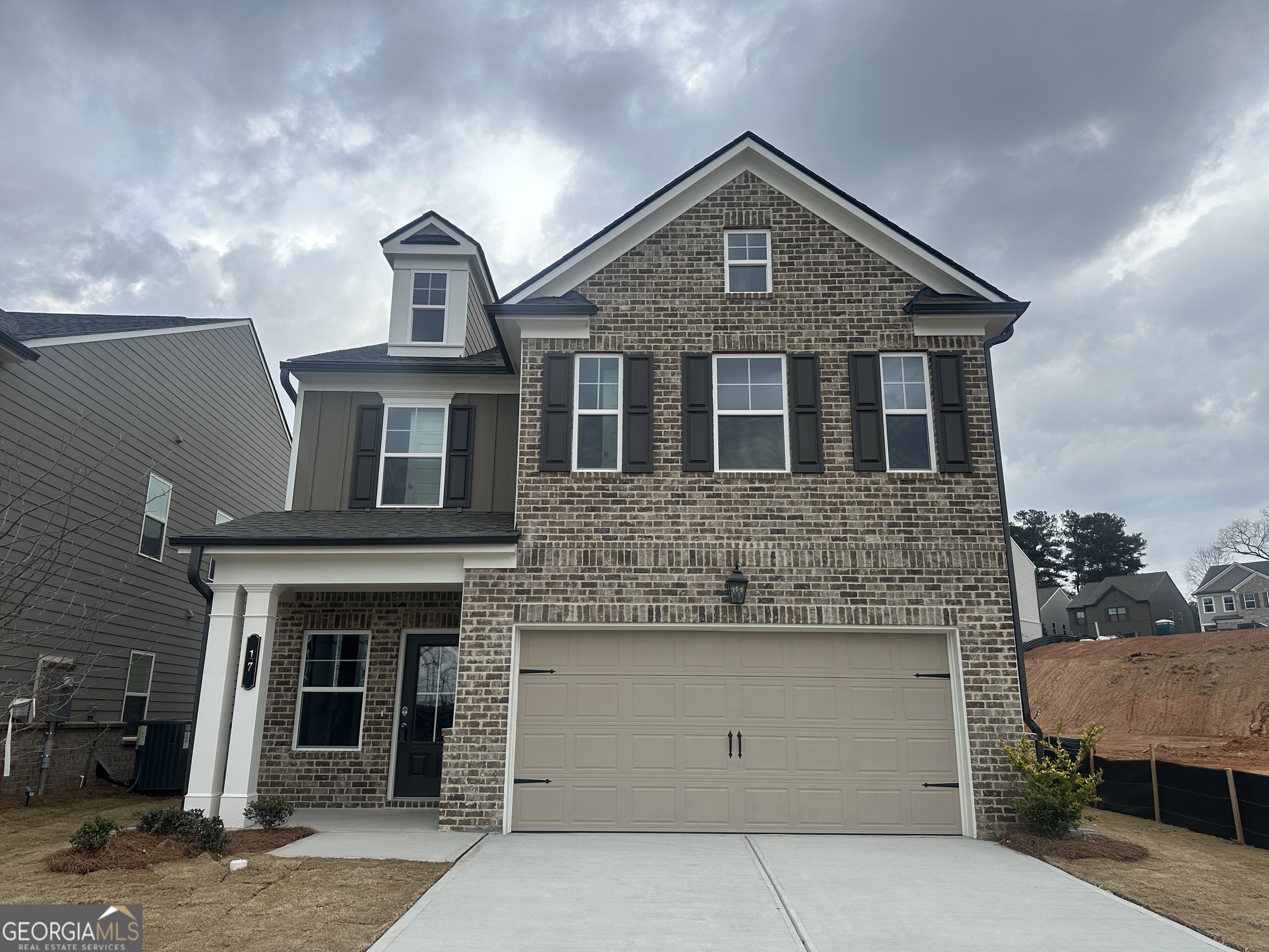 17 Butternut Way, Unit 118B Auburn, GA 30011 - Photo 1 of 53 a front view of a house with a garage