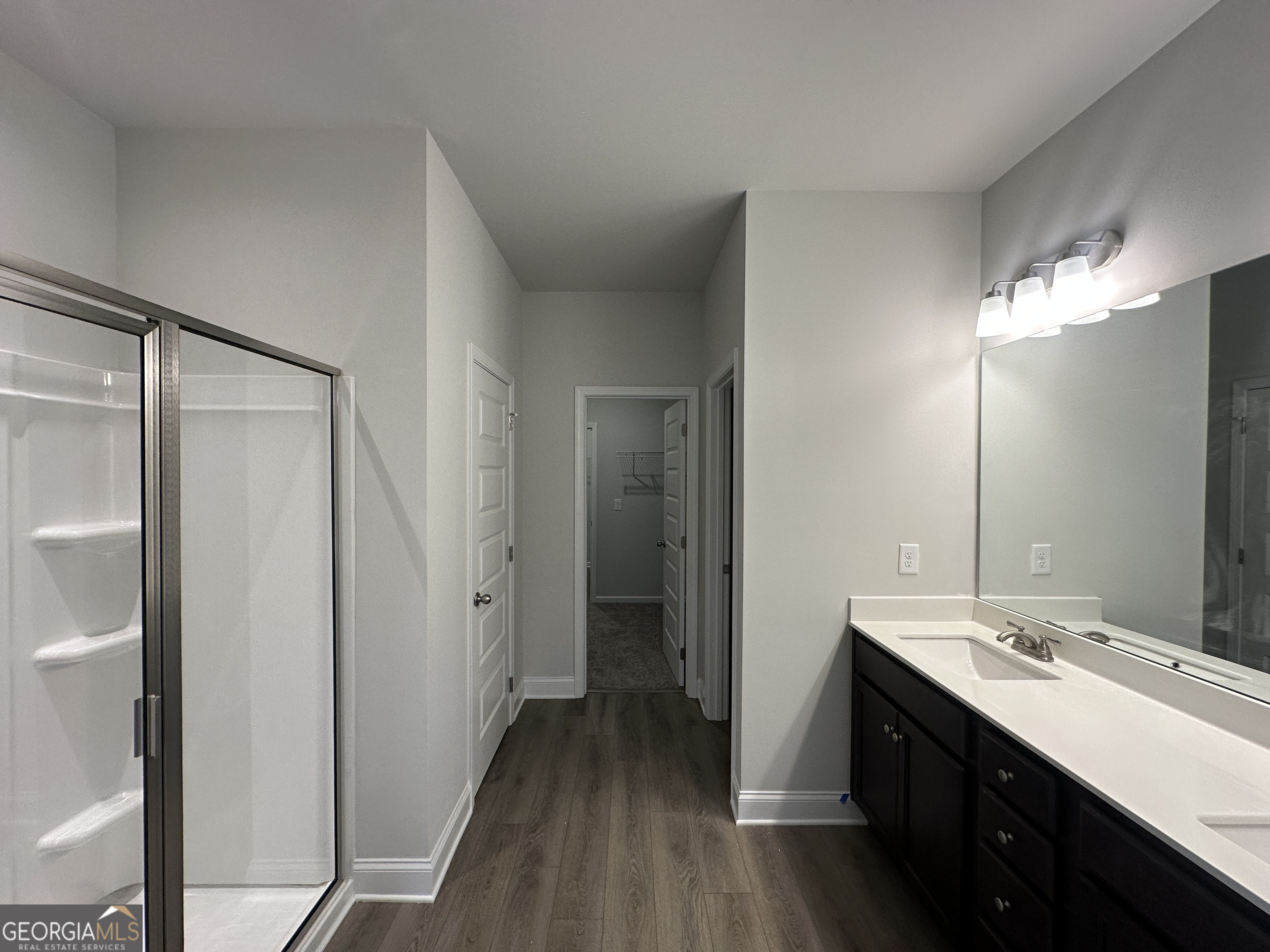 17 Butternut Way, Unit 118B Auburn, GA 30011 - Photo 11 of 53 a bathroom with a double vanity sink a toilet and a mirror