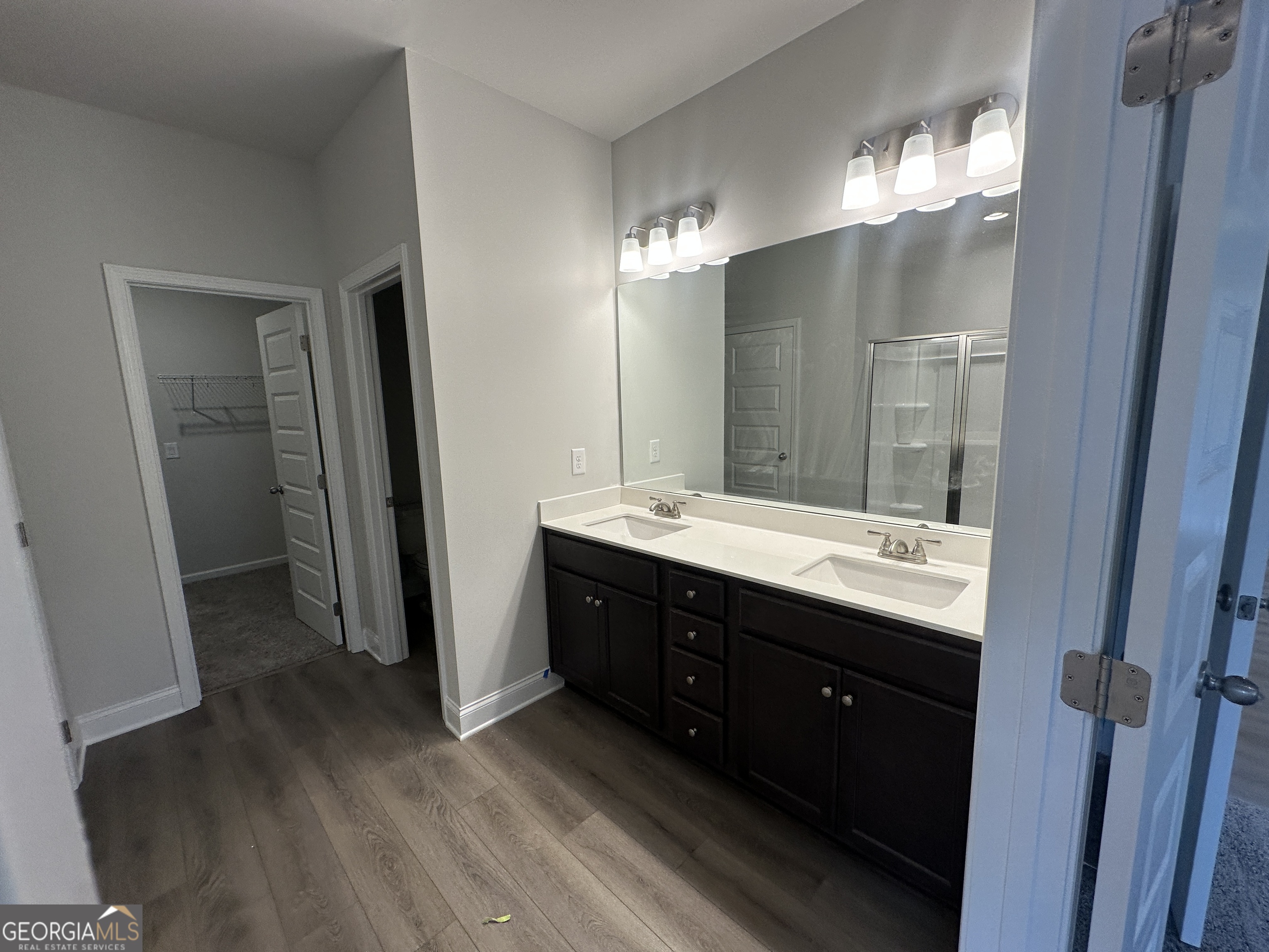 17 Butternut Way, Unit 118B Auburn, GA 30011 - Photo 12 of 53 a bathroom with a double vanity sink and mirror