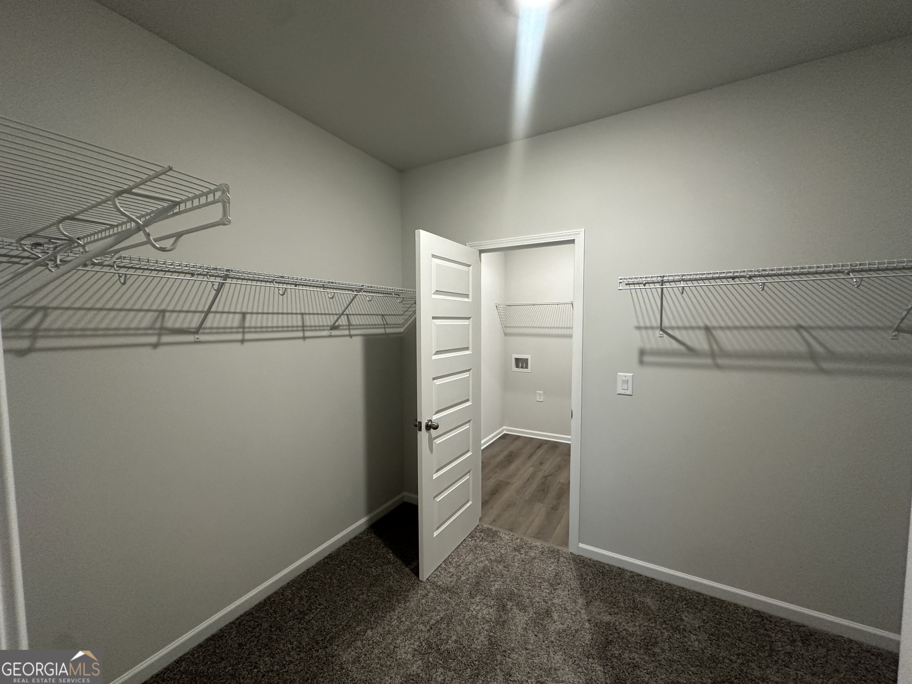 17 Butternut Way, Unit 118B Auburn, GA 30011 - Photo 14 of 53 a view of a room with racks on the wall