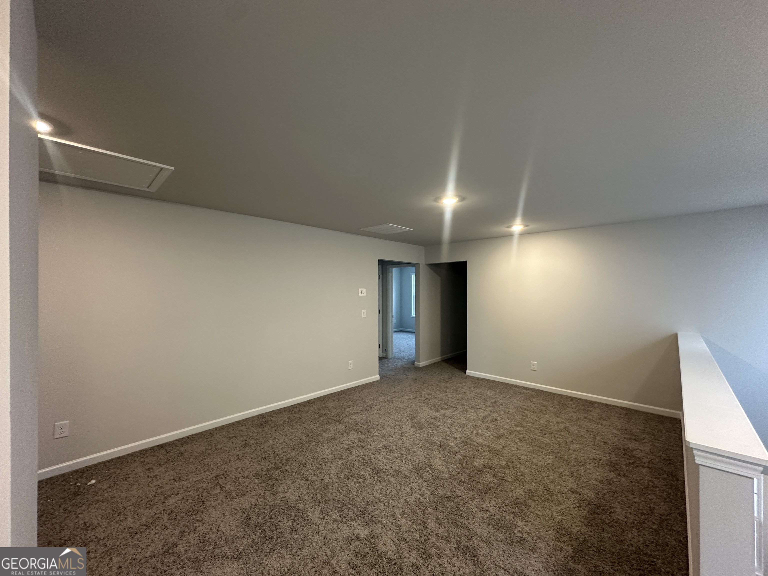 17 Butternut Way, Unit 118B Auburn, GA 30011 - Photo 19 of 53 an empty room with an entryway and fireplace