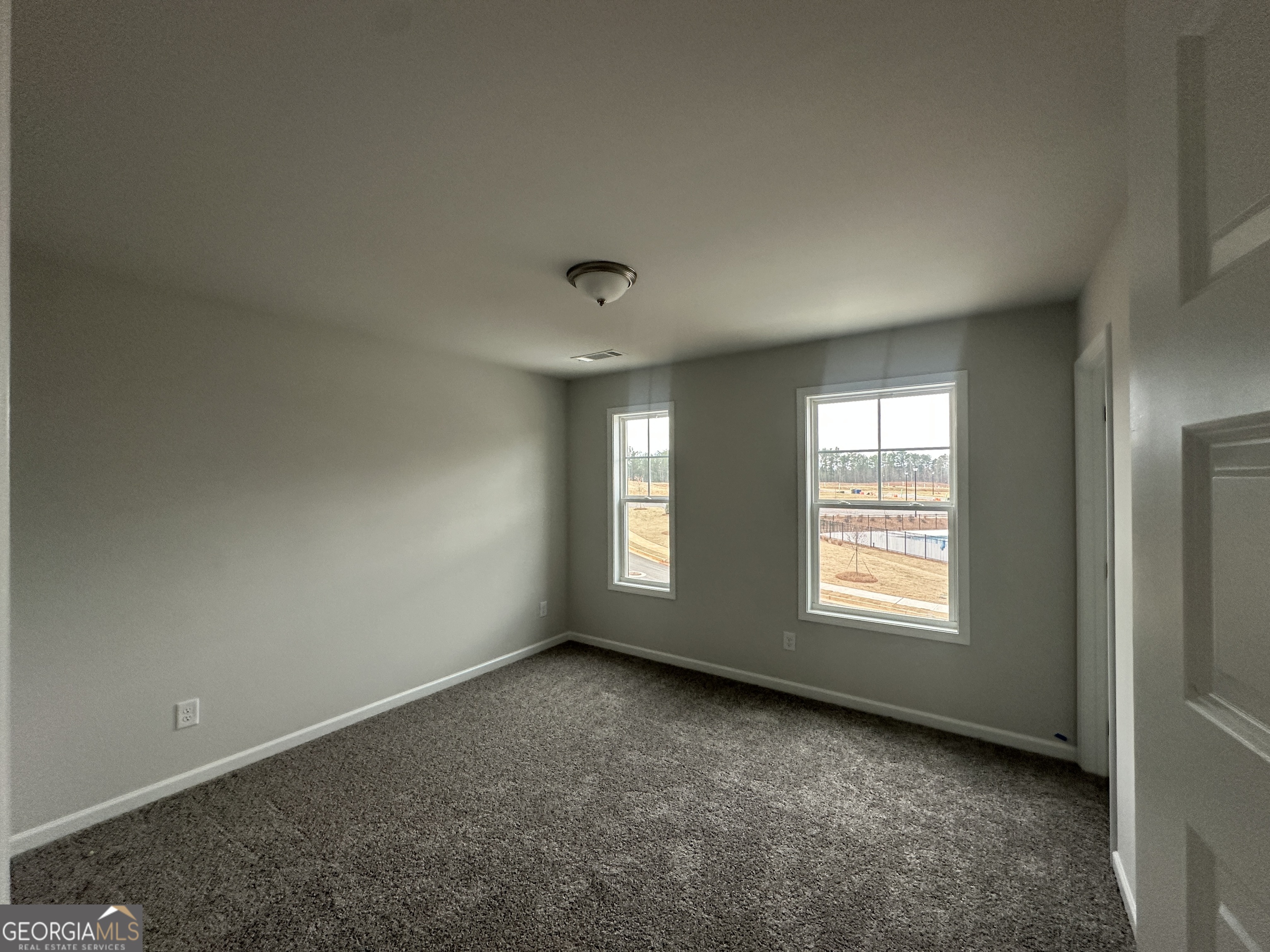 17 Butternut Way, Unit 118B Auburn, GA 30011 - Photo 21 of 53 an empty room with a window