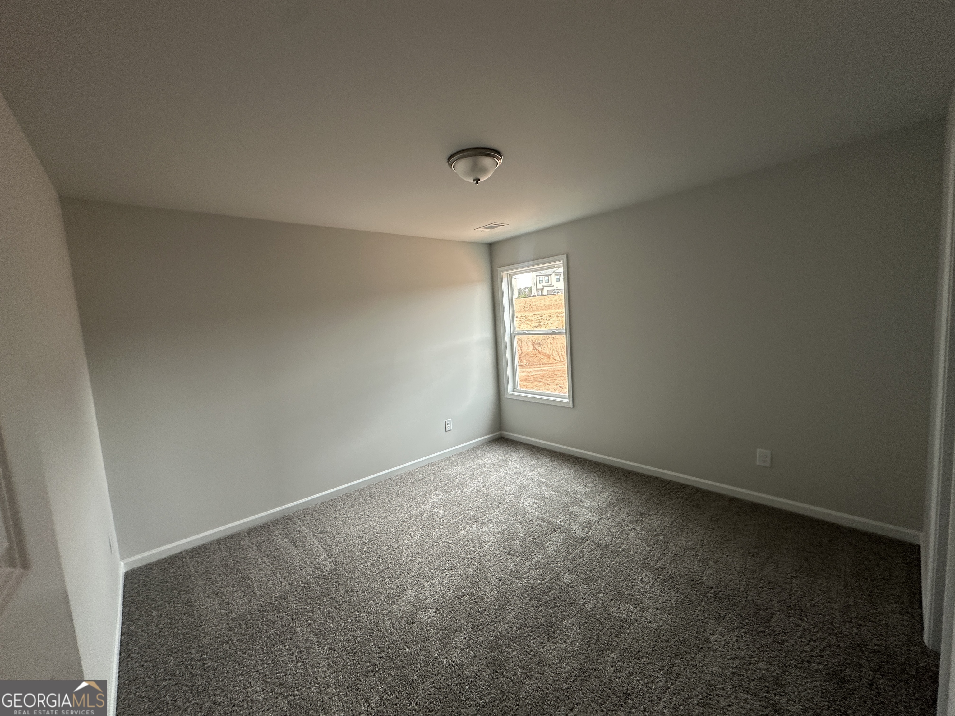 17 Butternut Way, Unit 118B Auburn, GA 30011 - Photo 22 of 53 an empty room with windows and closet