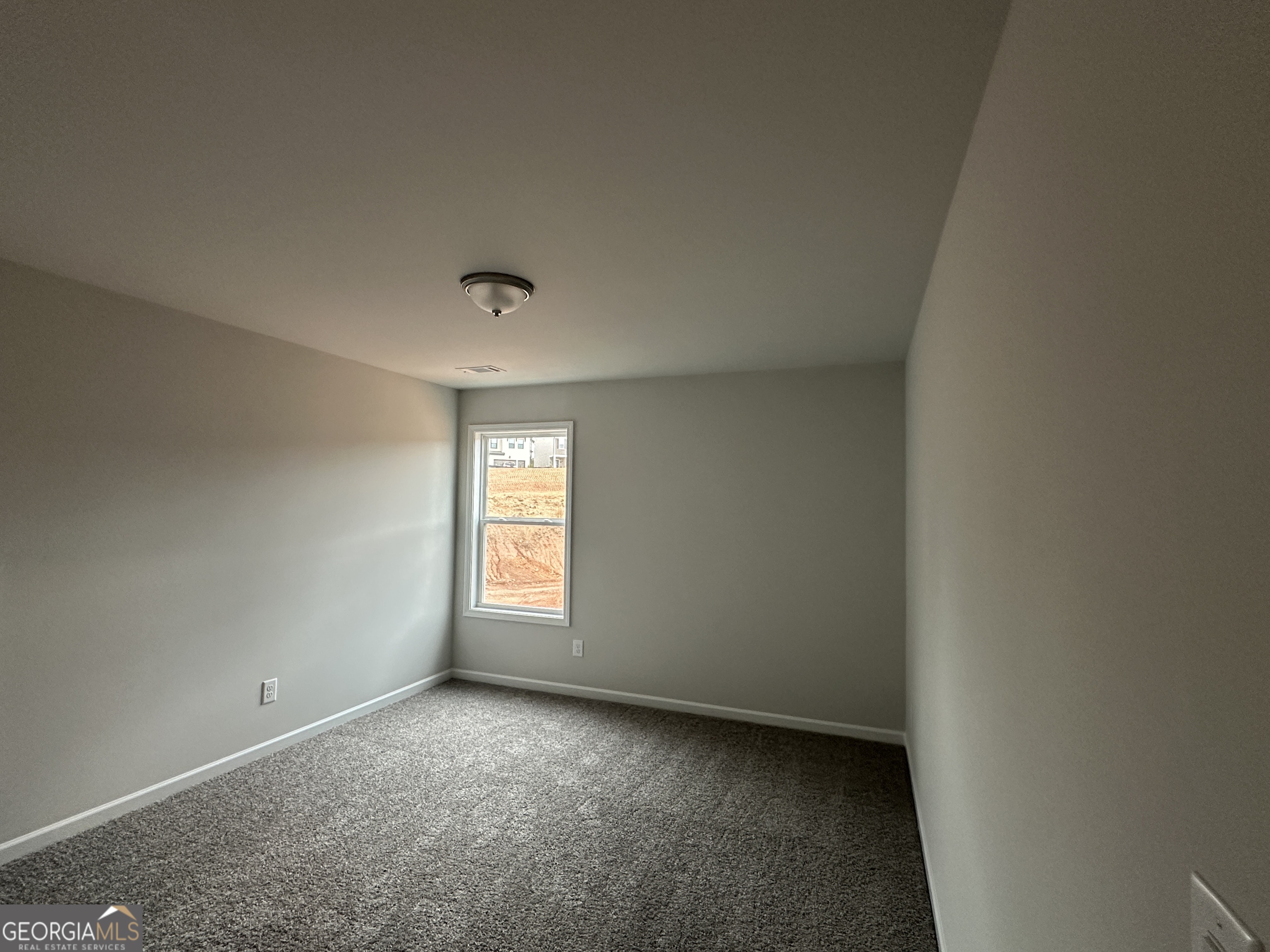 17 Butternut Way, Unit 118B Auburn, GA 30011 - Photo 25 of 53 a view of an empty room and window