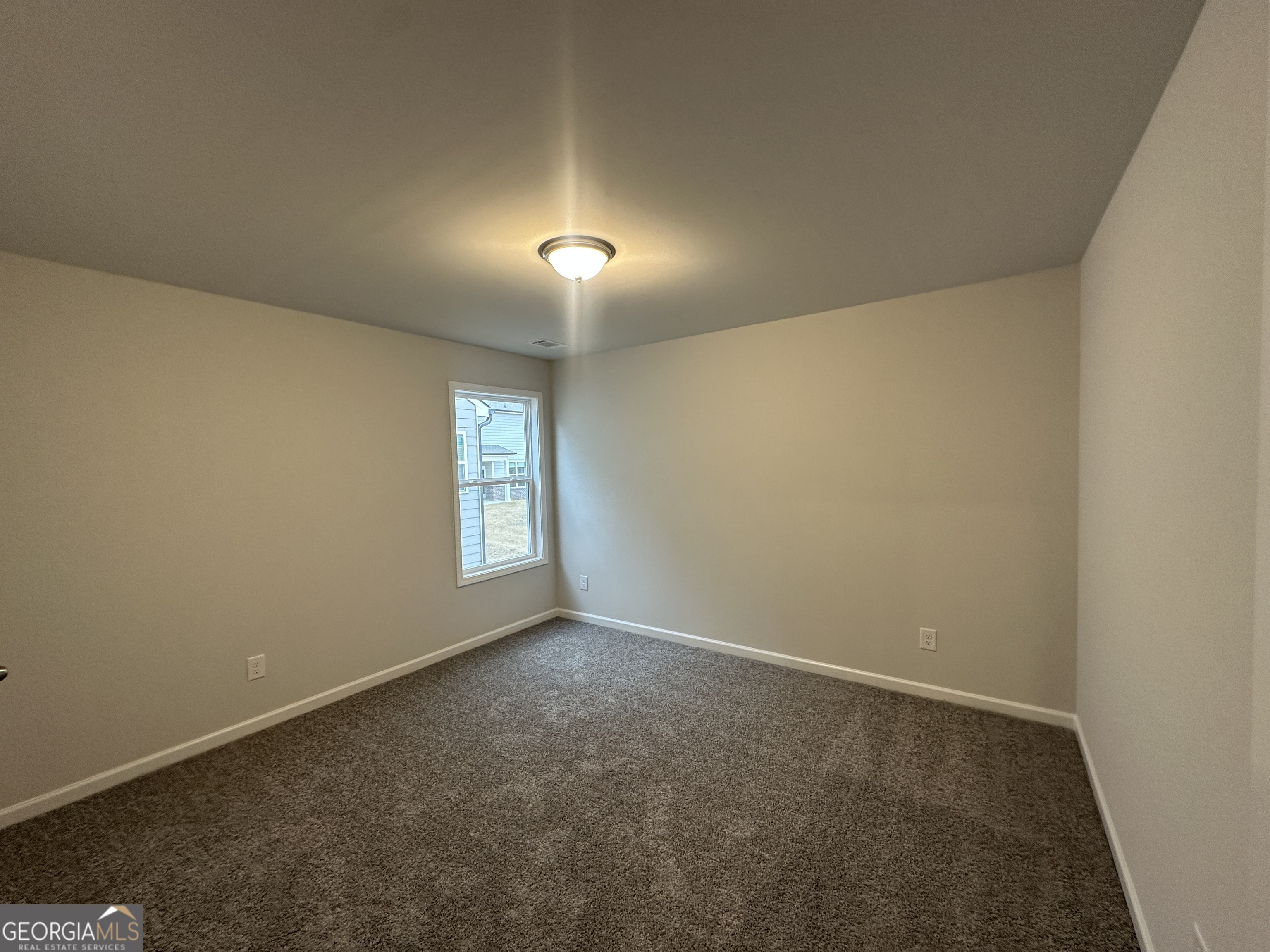 17 Butternut Way, Unit 118B Auburn, GA 30011 - Photo 26 of 53 an empty room with windows and closet