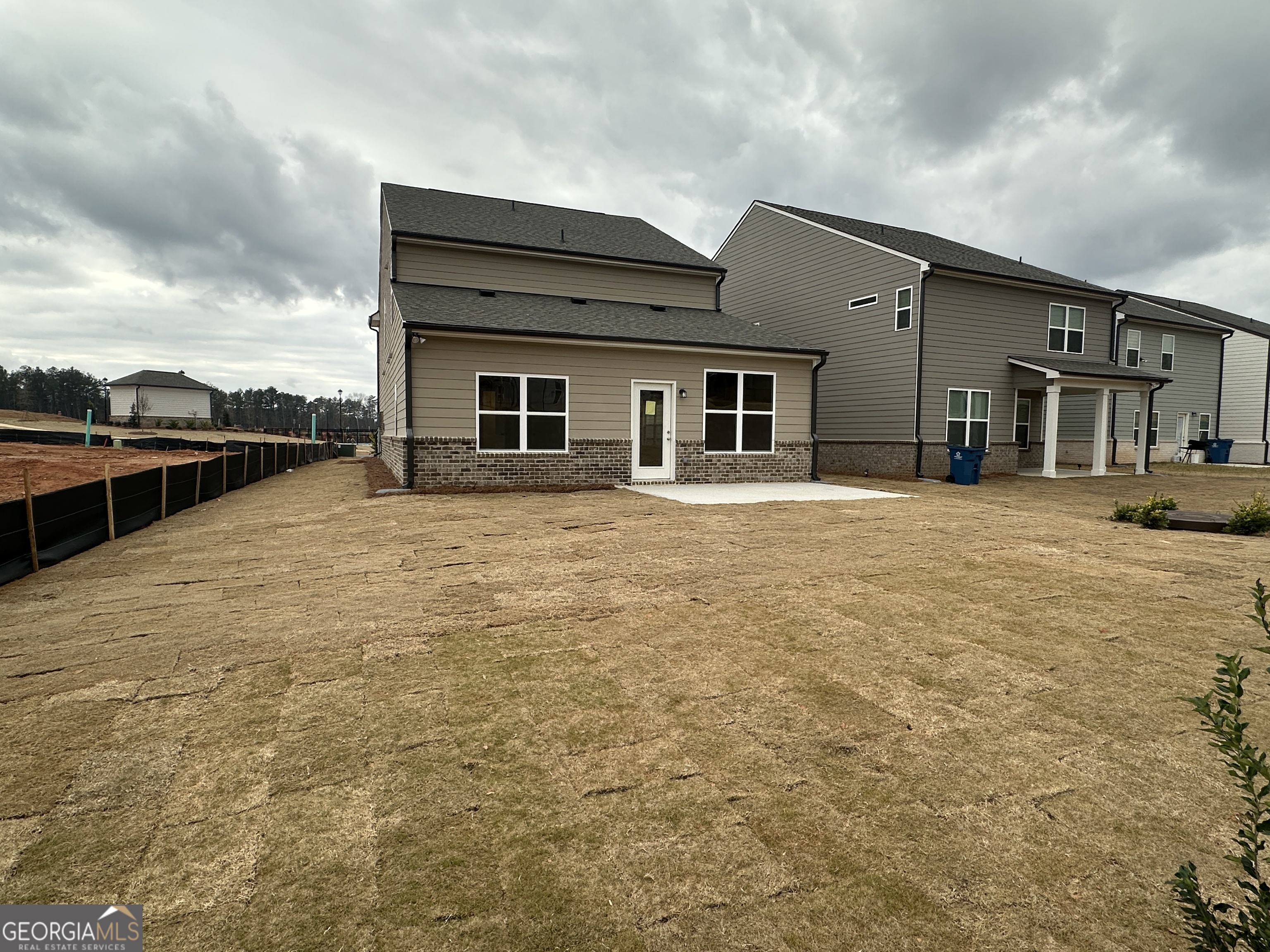 17 Butternut Way, Unit 118B Auburn, GA 30011 - Photo 29 of 53 a large house with a outdoor space
