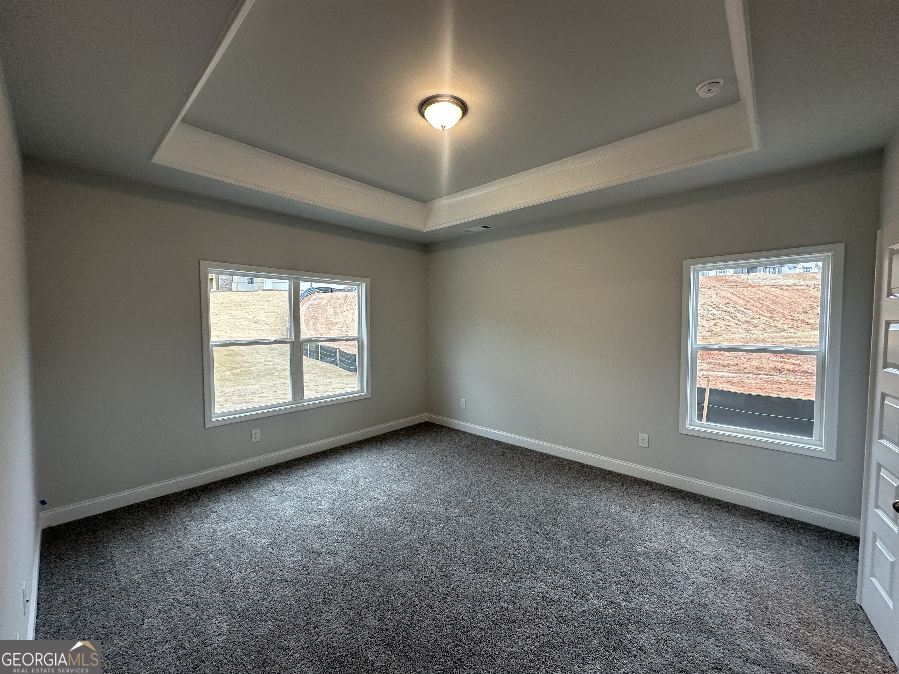 17 Butternut Way, Unit 118B Auburn, GA 30011 - Photo 9 of 53 an empty room with a empty space and windows