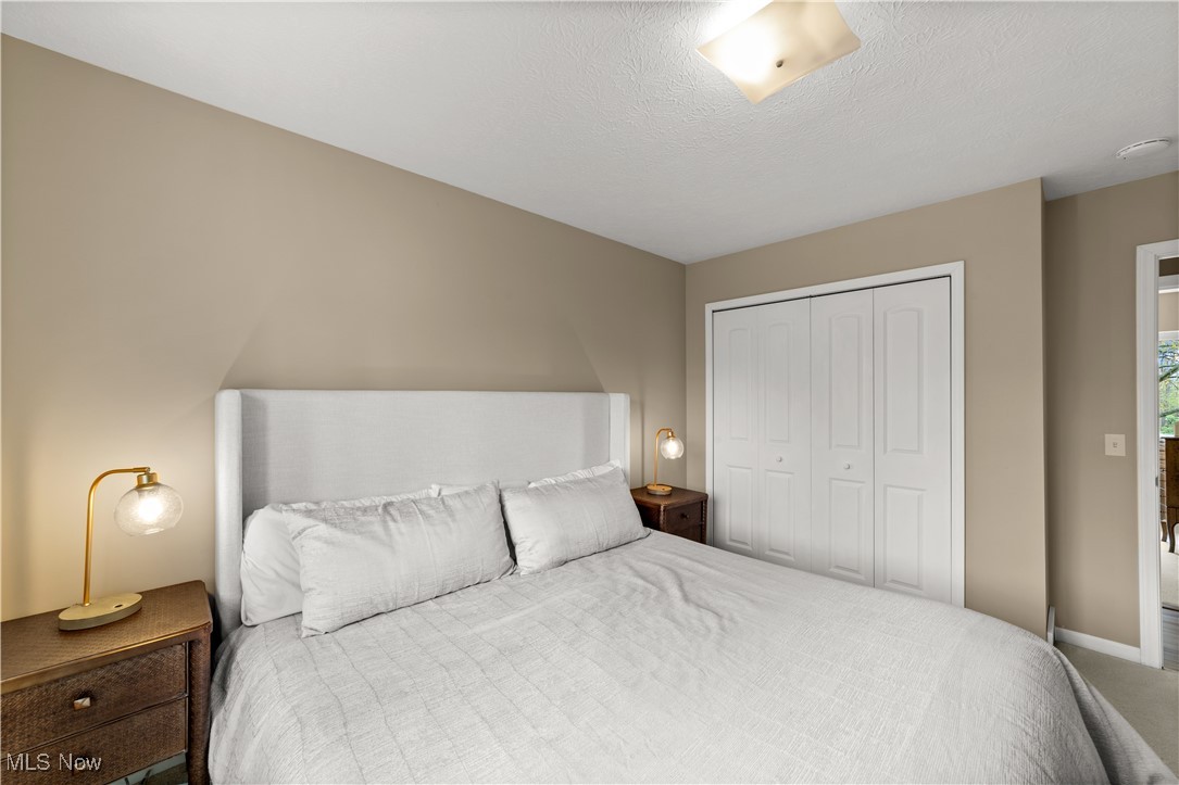 2977 Reeves Road Willoughby, OH 44094 - Photo 23 of 49 Carpeted bedroom with baseboards and a closet