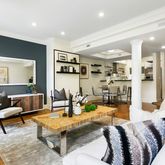 a living room with furniture and a table
