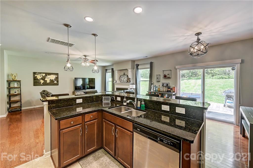 923 Rook Road Charlotte, NC 28216 - Photo 11 of 36 a kitchen with a sink stove and refrigerator