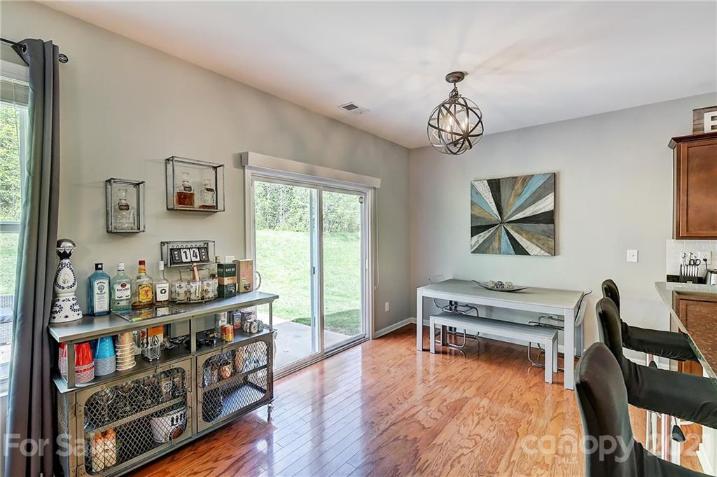 923 Rook Road Charlotte, NC 28216 - Photo 15 of 36 a living room with furniture a desk and a window