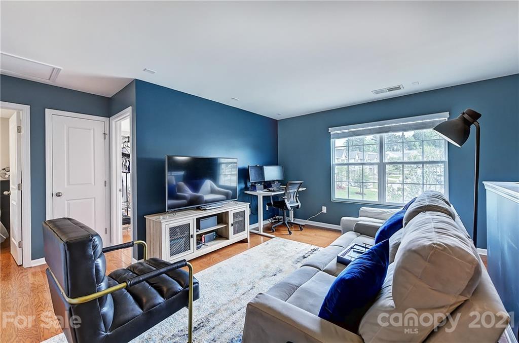 923 Rook Road Charlotte, NC 28216 - Photo 18 of 36 a living room with furniture and a flat screen tv