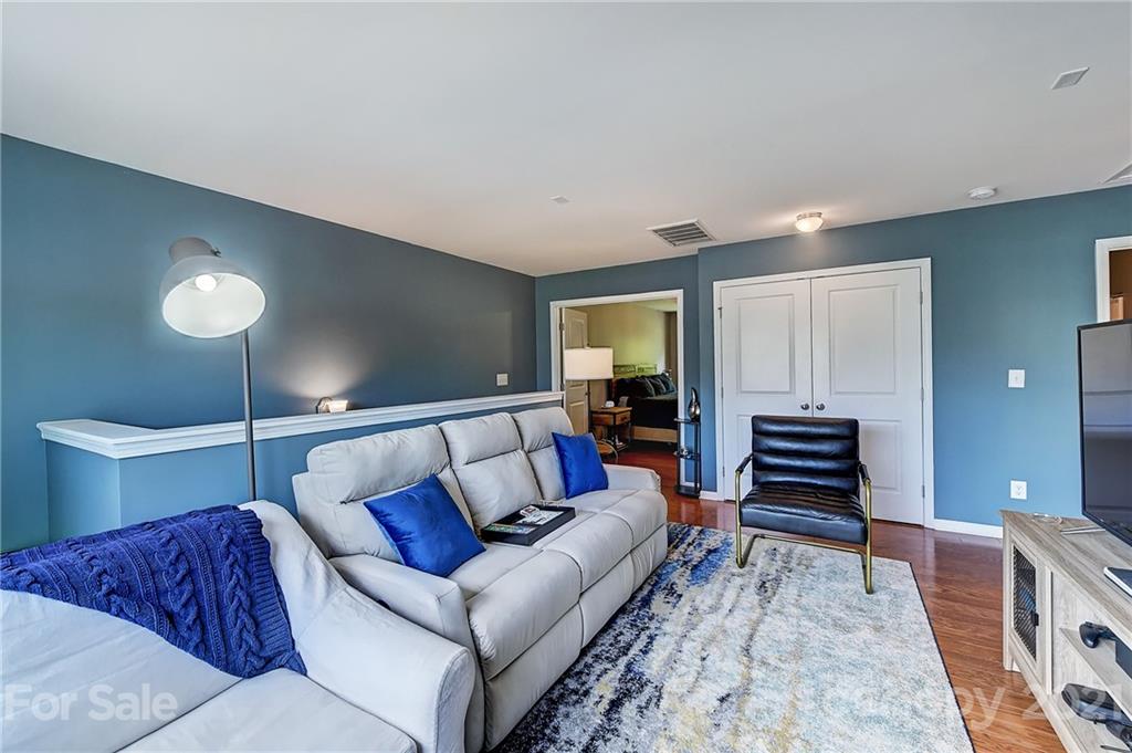923 Rook Road Charlotte, NC 28216 - Photo 19 of 36 a living room with furniture and a wooden floor