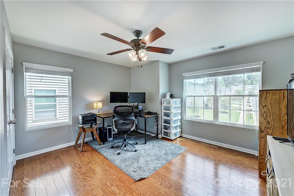 923 Rook Road Charlotte, NC 28216 - Photo 28 of 36 a view of a workspace with furniture and a window