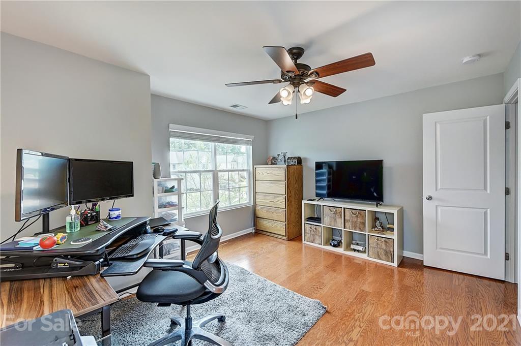 923 Rook Road Charlotte, NC 28216 - Photo 29 of 36 a view of a livingroom with furniture and a flat screen tv