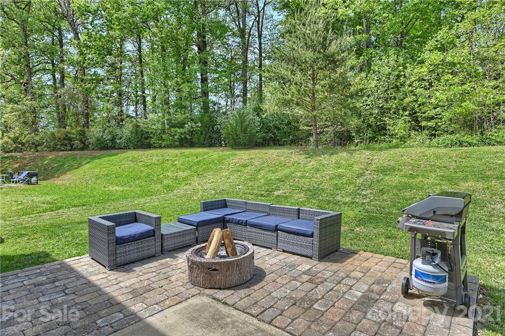 923 Rook Road Charlotte, NC 28216 - Photo 30 of 36 a view of a backyard with sitting area and garden