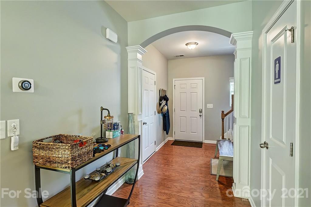 923 Rook Road Charlotte, NC 28216 - Photo 4 of 36 a very nice looking room with wooden floor and a bathroom