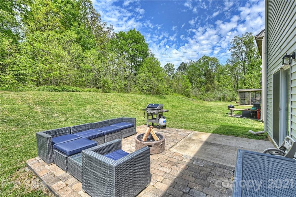 923 Rook Road Charlotte, NC 28216 - Photo 31 of 36 a view of a backyard with sitting area