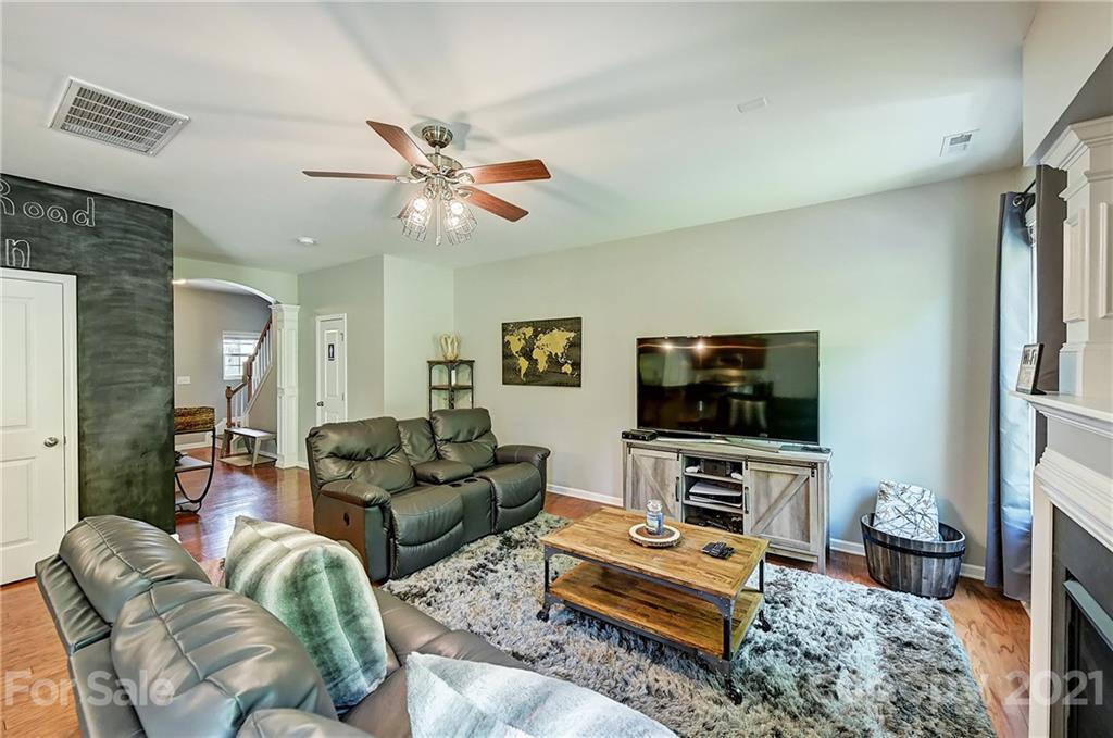 923 Rook Road Charlotte, NC 28216 - Photo 8 of 36 a living room with furniture and a flat screen tv