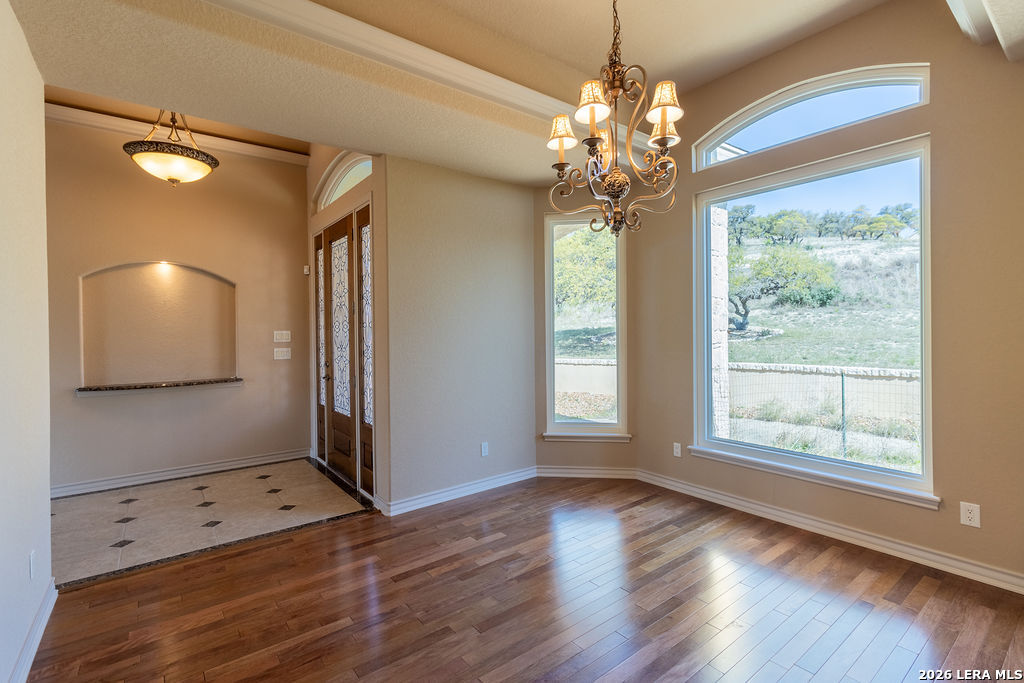198 Echo Falls Road Comfort, TX 78013 - Photo 8 of 28 a view of a room with window and chandelier