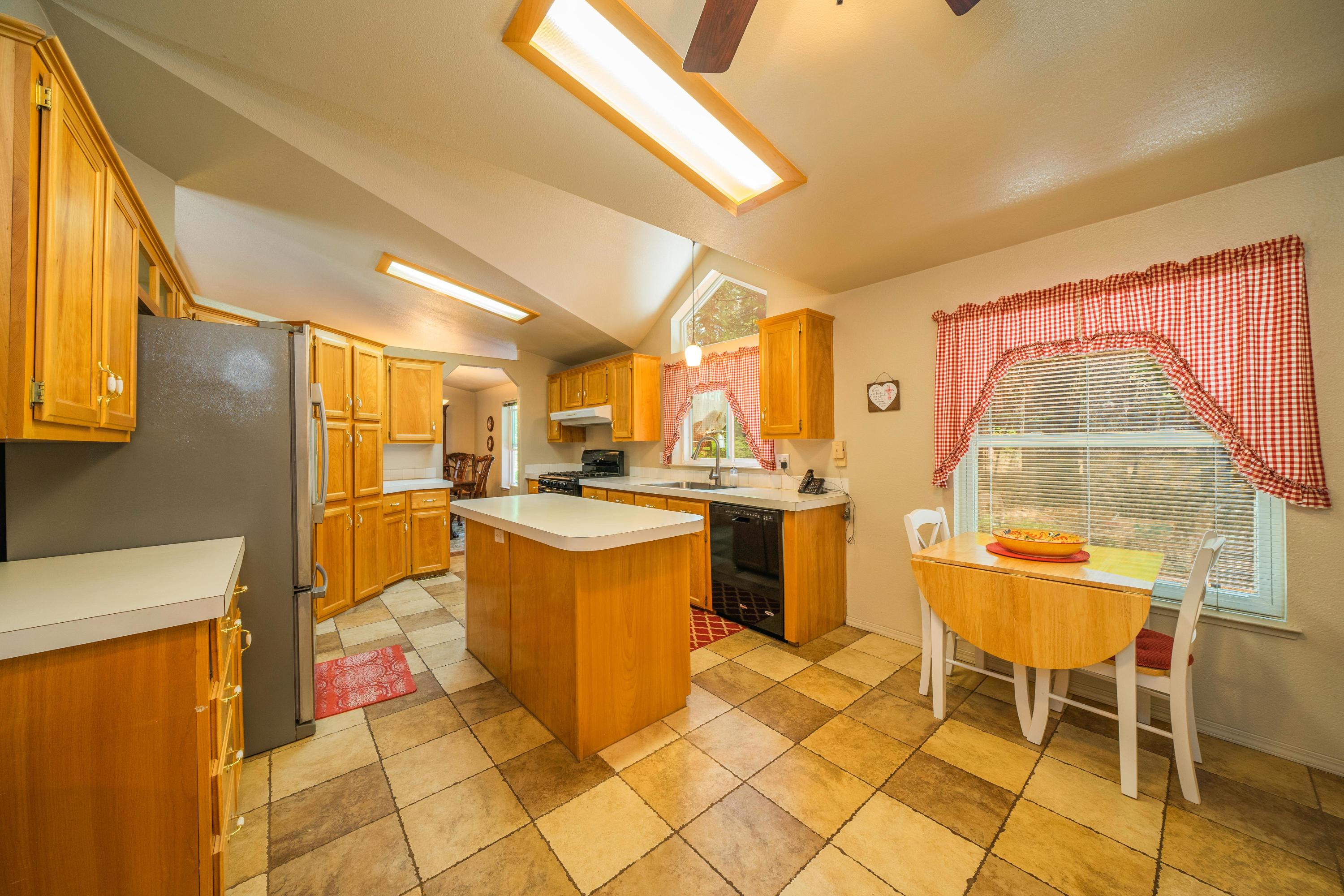 34739 Timber Ridge Road Shingletown, CA 96088 - Photo 11 of 26 a view of a kitchen with appliances and furniture