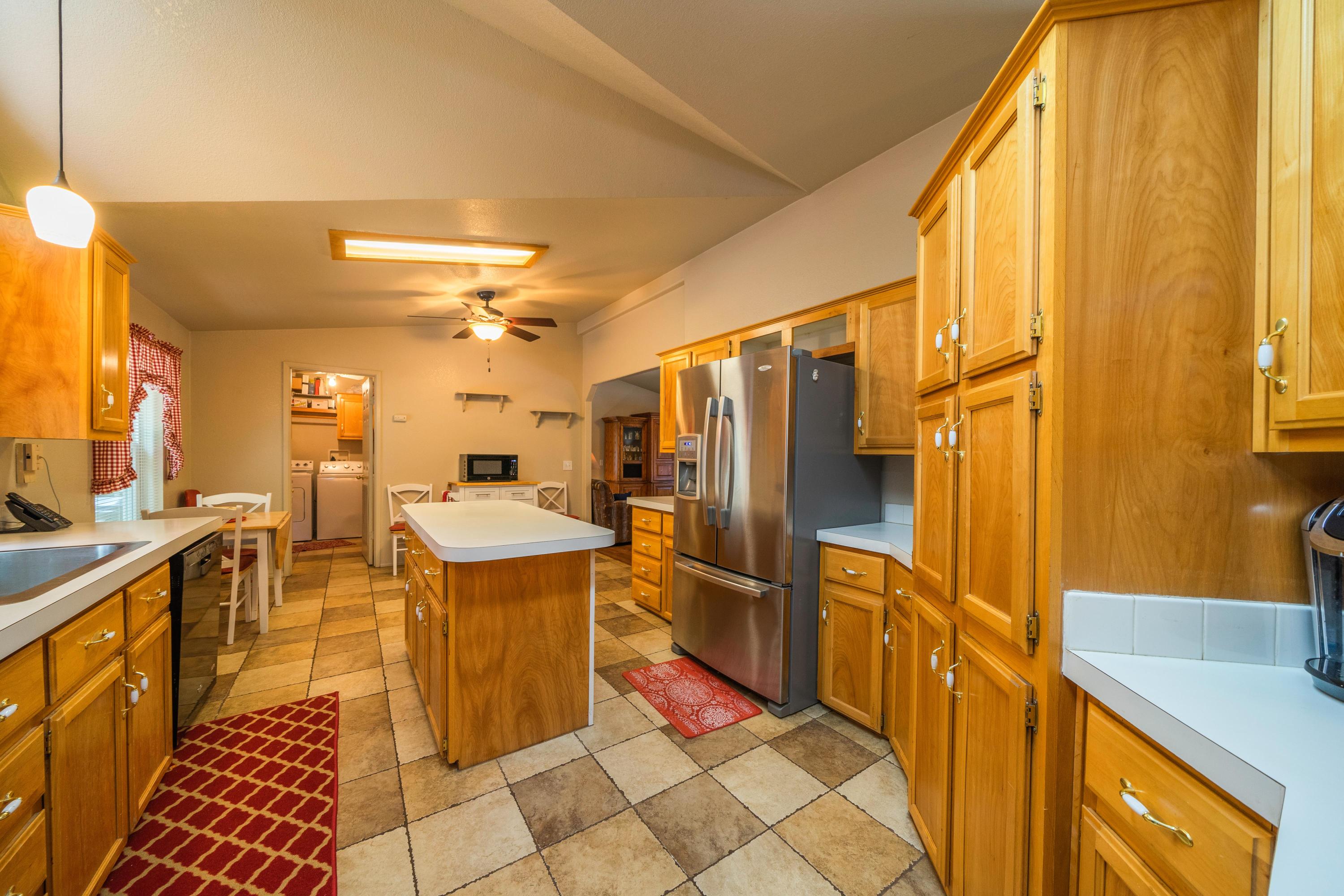 34739 Timber Ridge Road Shingletown, CA 96088 - Photo 12 of 26 a kitchen with stainless steel appliances granite countertop a refrigerator and a stove