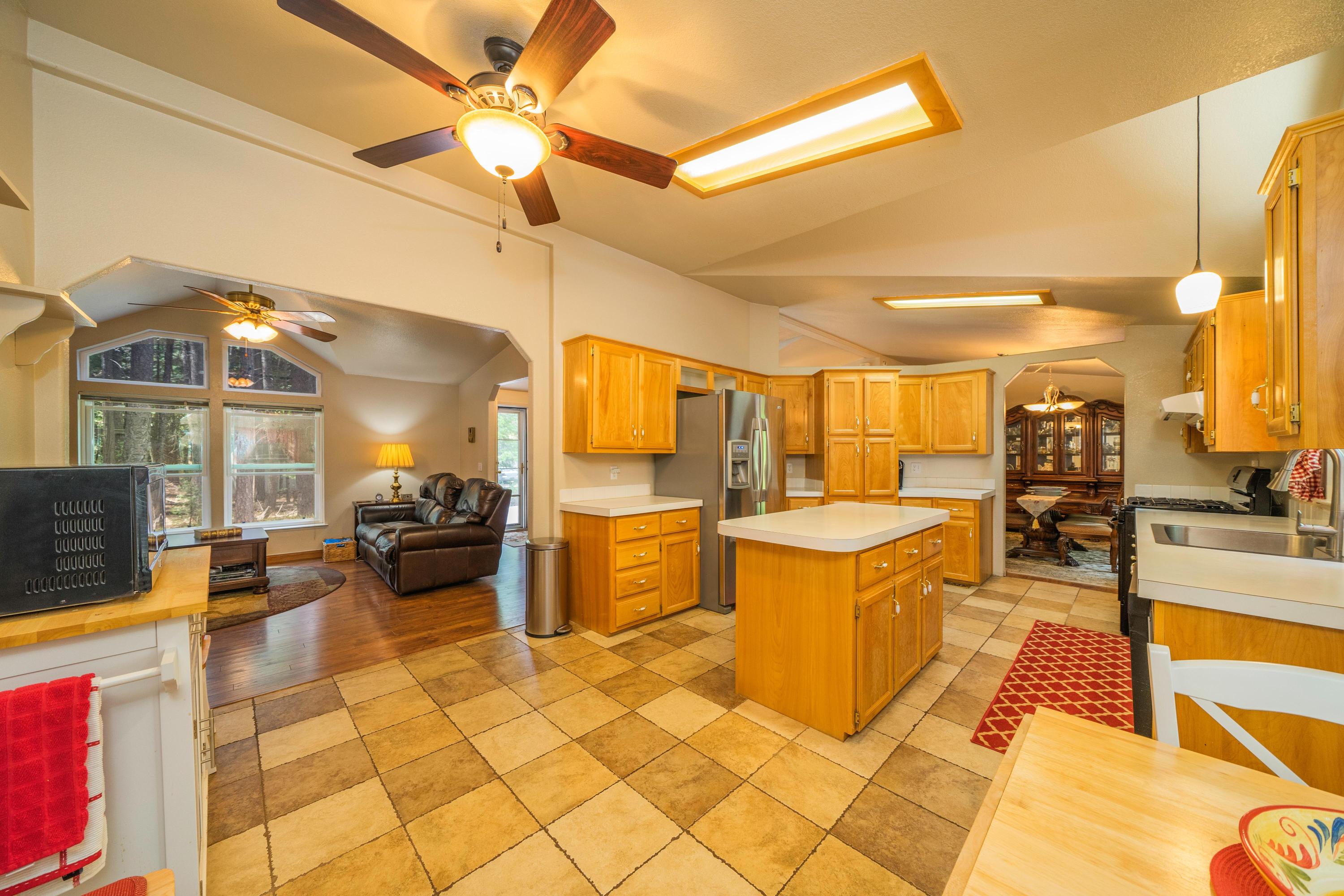 34739 Timber Ridge Road Shingletown, CA 96088 - Photo 14 of 26 a view of a living room and kitchen