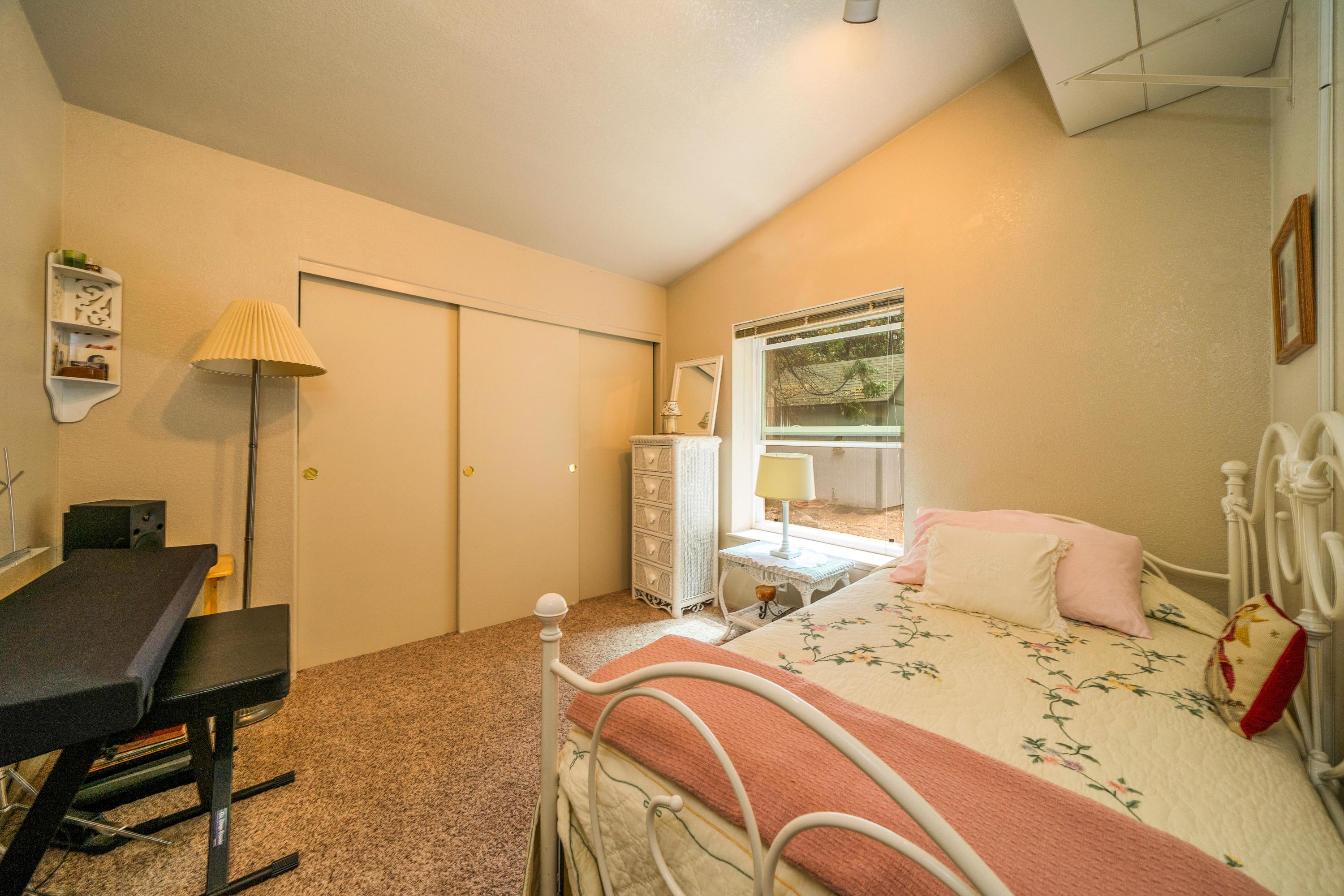 34739 Timber Ridge Road Shingletown, CA 96088 - Photo 15 of 26 a bedroom with a bed and a desk