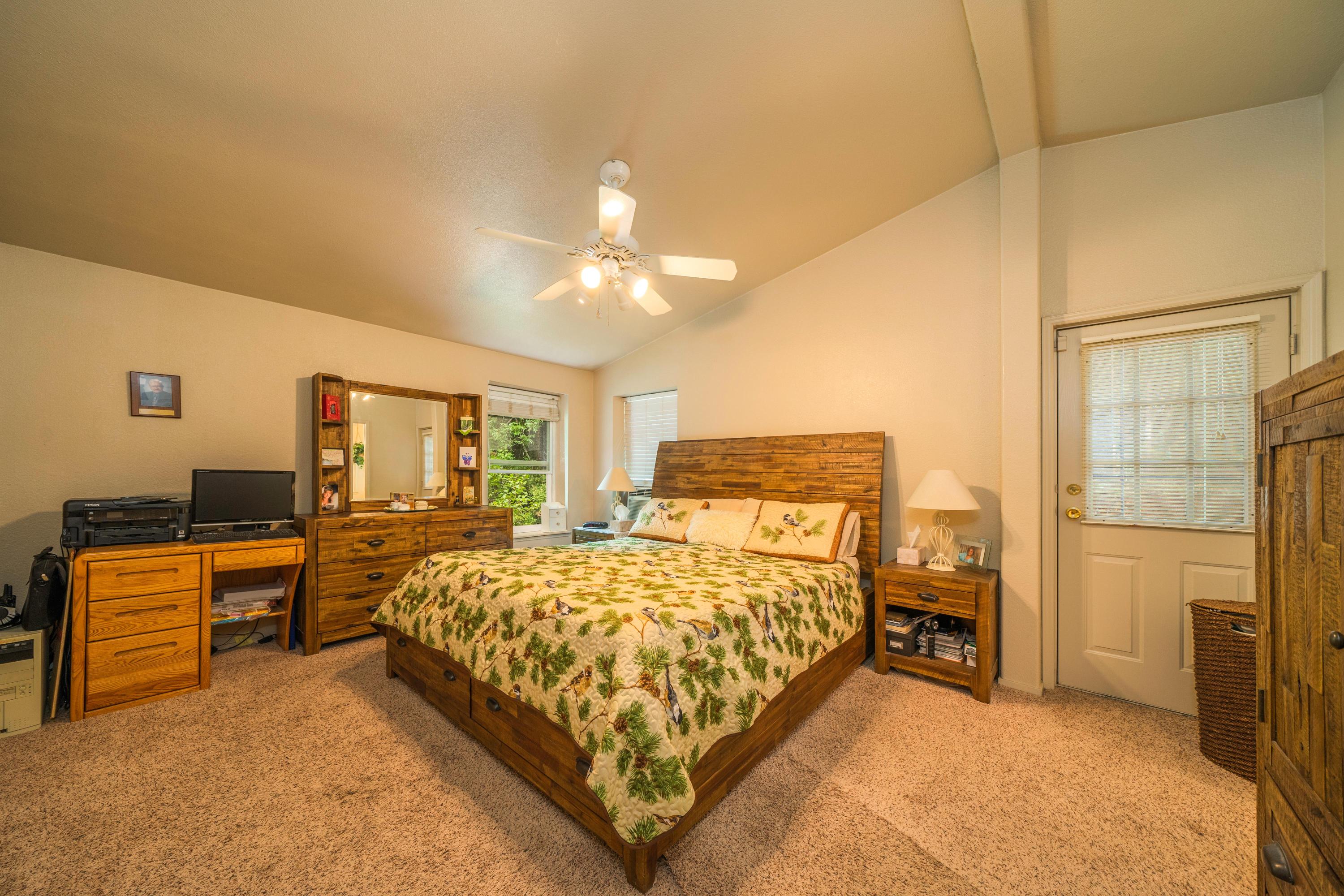 34739 Timber Ridge Road Shingletown, CA 96088 - Photo 17 of 26 a bedroom with a bed and furniture